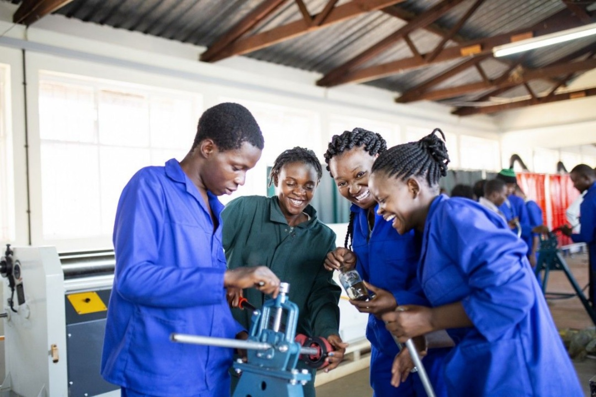 People learning practical skills together in a workshop
