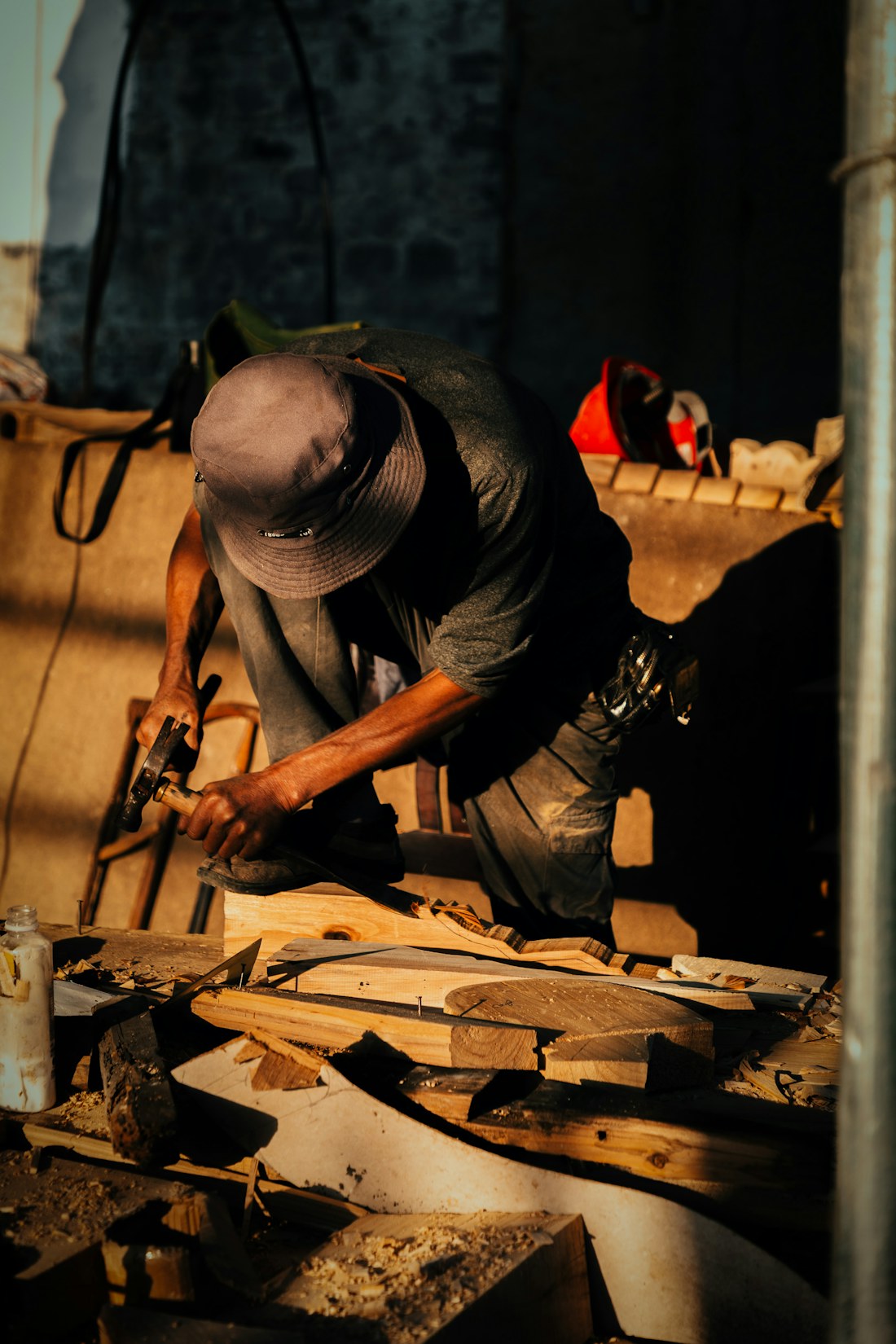 Carpenter shaping wood in a workshop